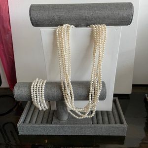 5 strand cream/ off white fresh water pearl necklace and bracelet set.